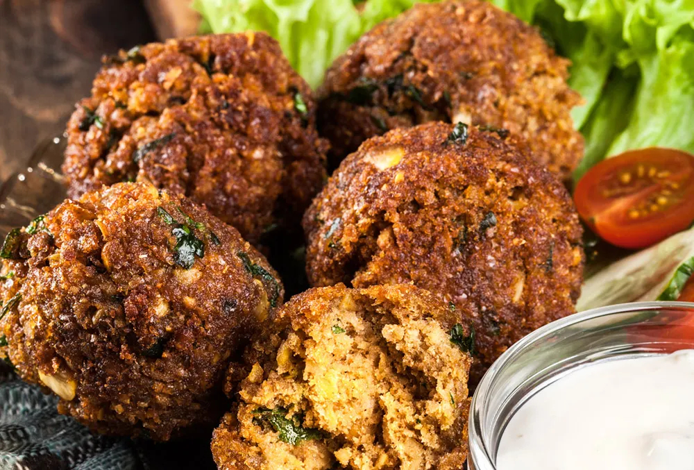 Kürbis-Topfen-Nockerln mit Kernölsauce